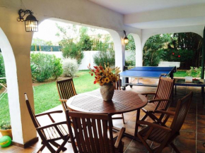 Family villa with garden next to the beach